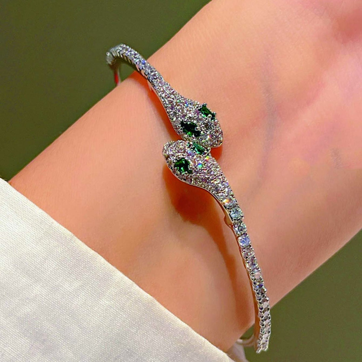 Schlangen-Strass-Grünauge-glänzendes Silberarmband