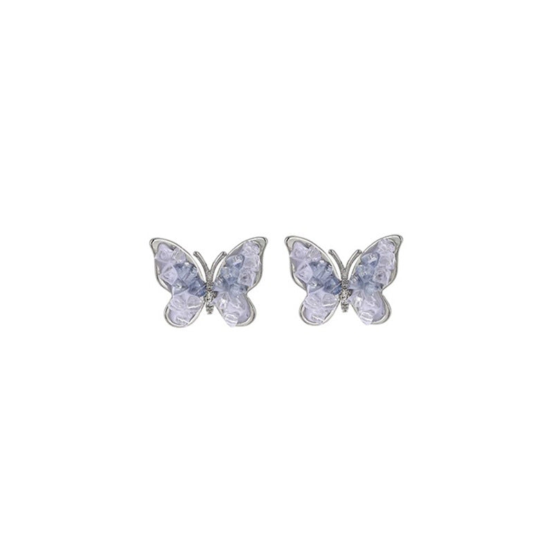 Eleganter Ohrstecker mit Schmetterling und Blume in Blau mit Kristall